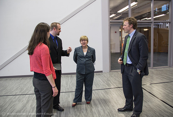Award recipients Jen Ellsworth and Adam Moy, MCC President Susan Huard, and MCC VP John Cook